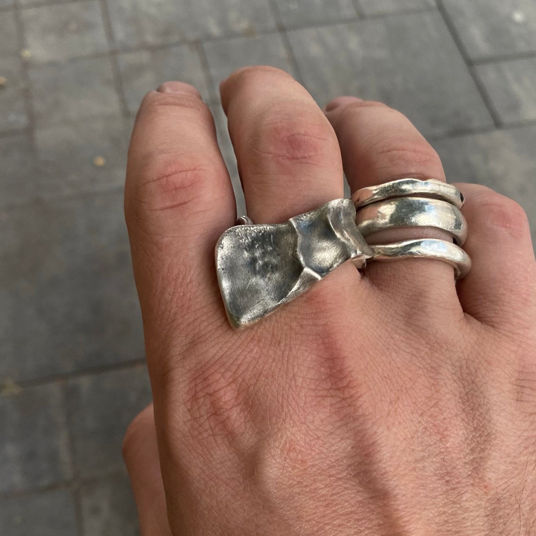 Irregular ring with a bold design, crafted from sterling silver.