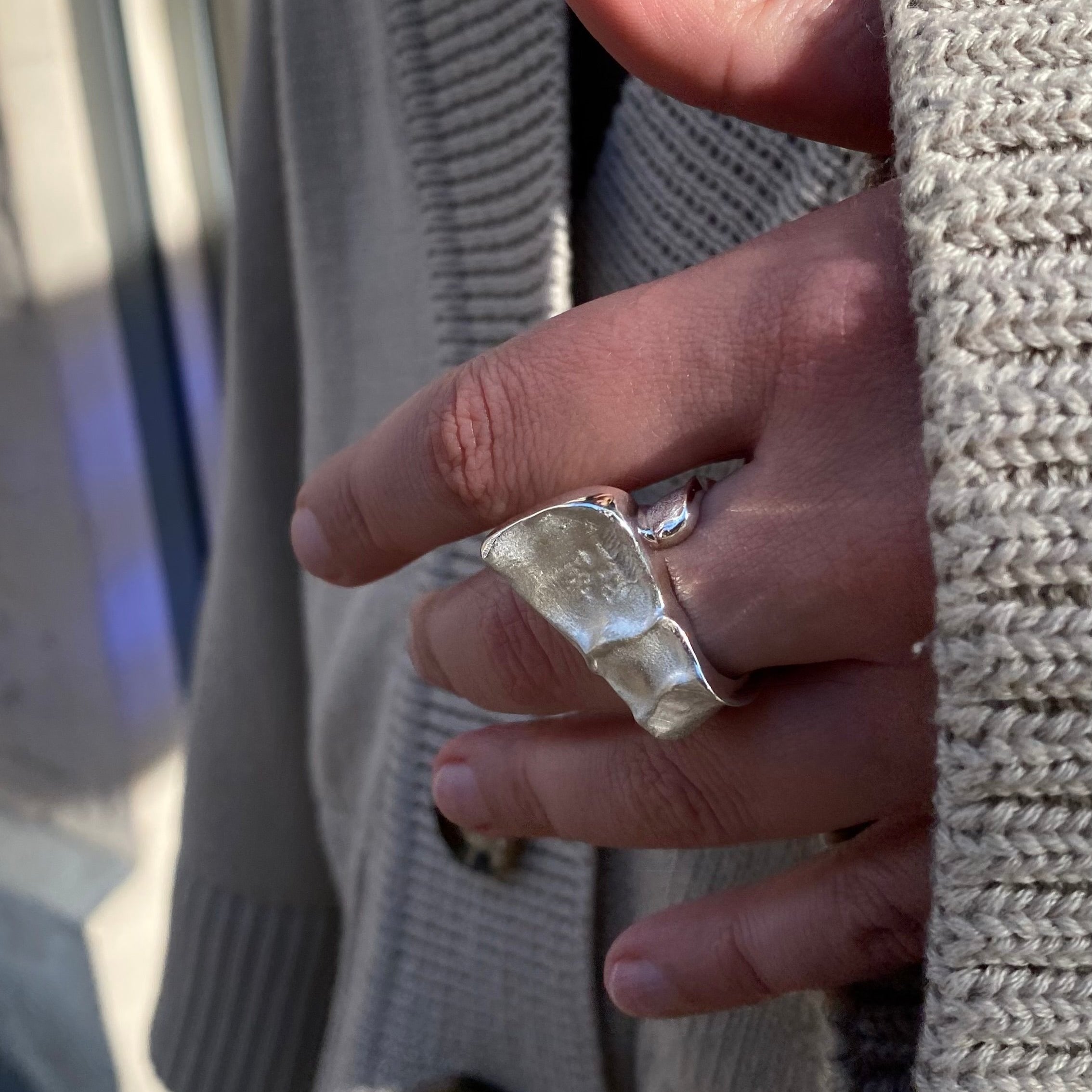 Sophisticated sterling silver ring with triangular bar accent and refined metallic finish