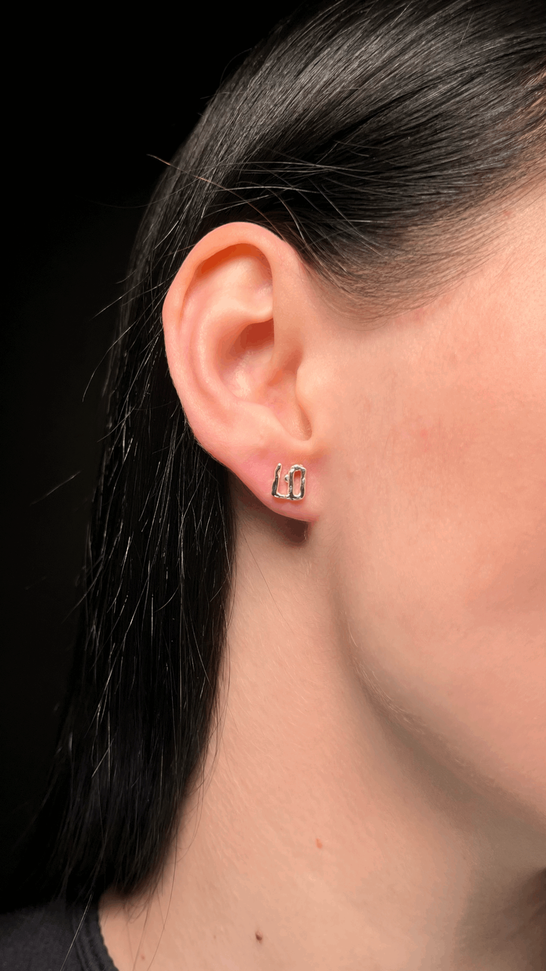 Silver stud earring with a minimalist and timeless design.