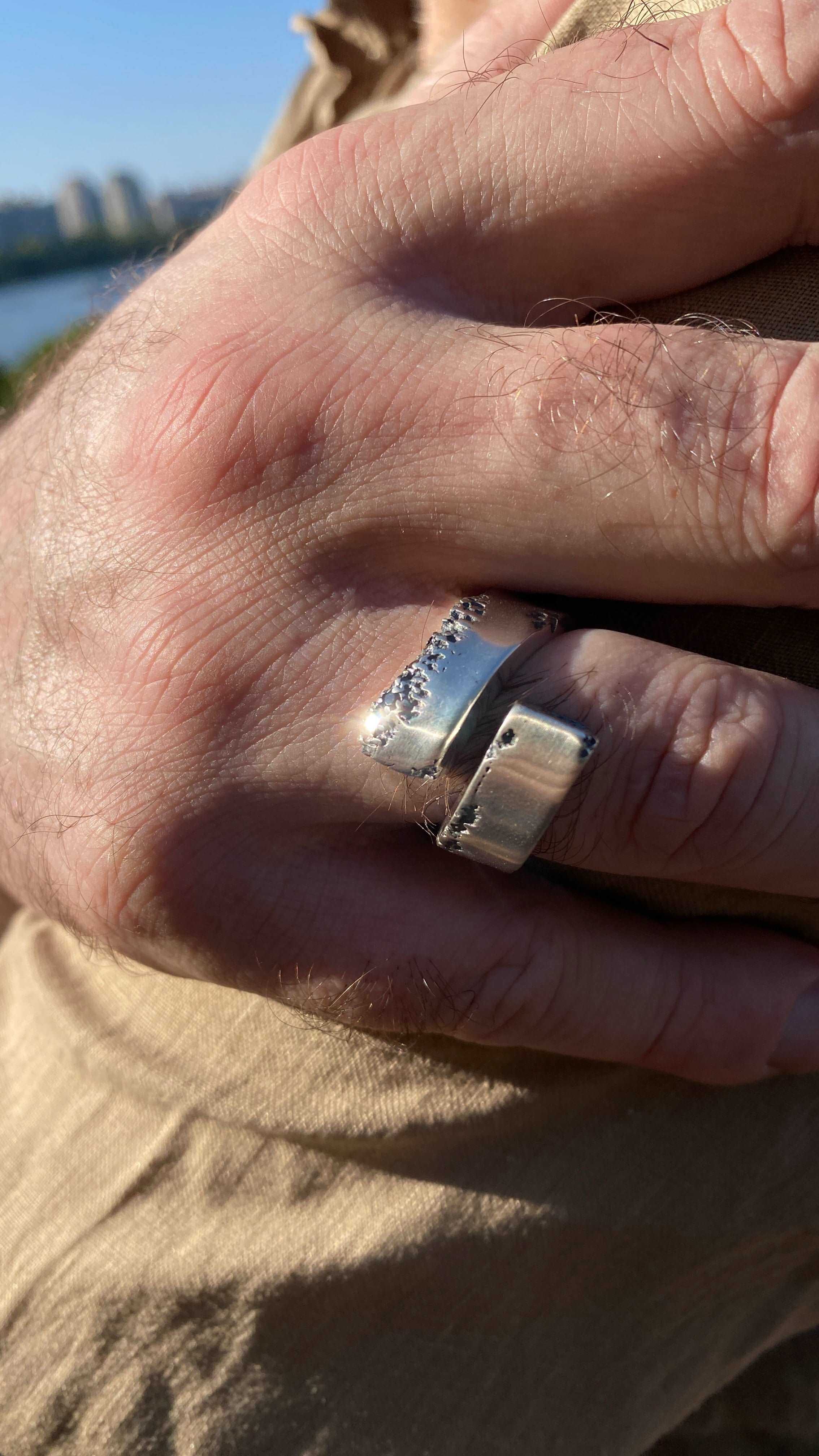 Close-up of a sterling silver ring featuring a black spinel gemstone.