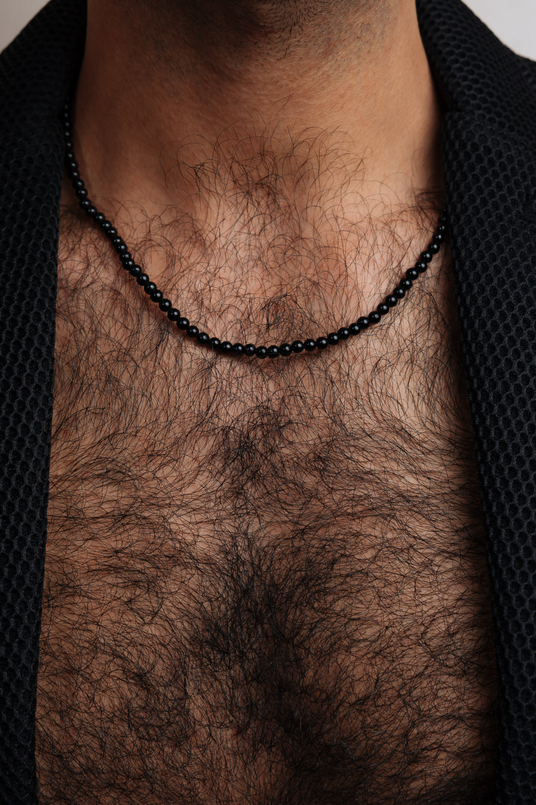 Bold silver pendant featuring polished black onyx stone