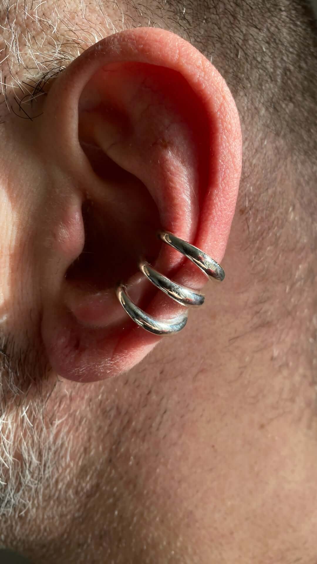 Handcrafted triple silver earcuff featuring a clean architectural form and strong presence