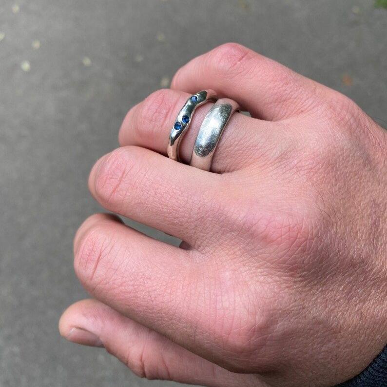 Unique blue stone ring with intricate textures and detailed craftsmanship.