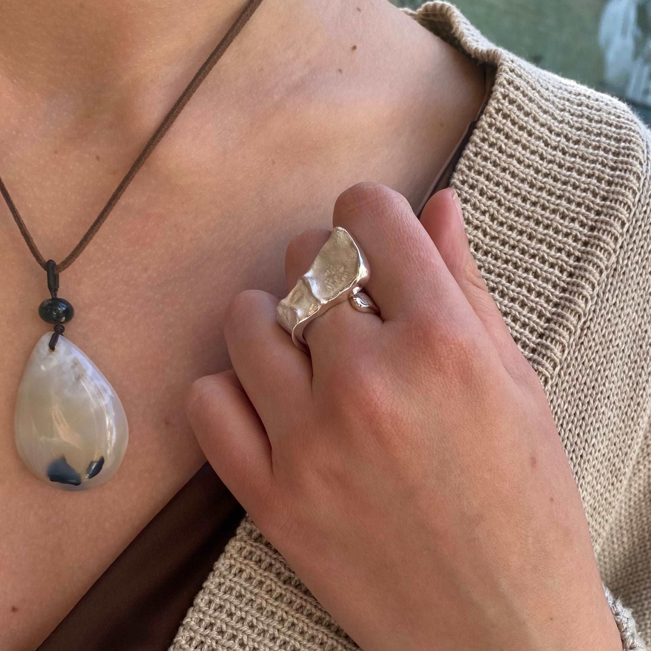 Irregular silver ring with innovative structural lines and contemporary masculine aesthetic