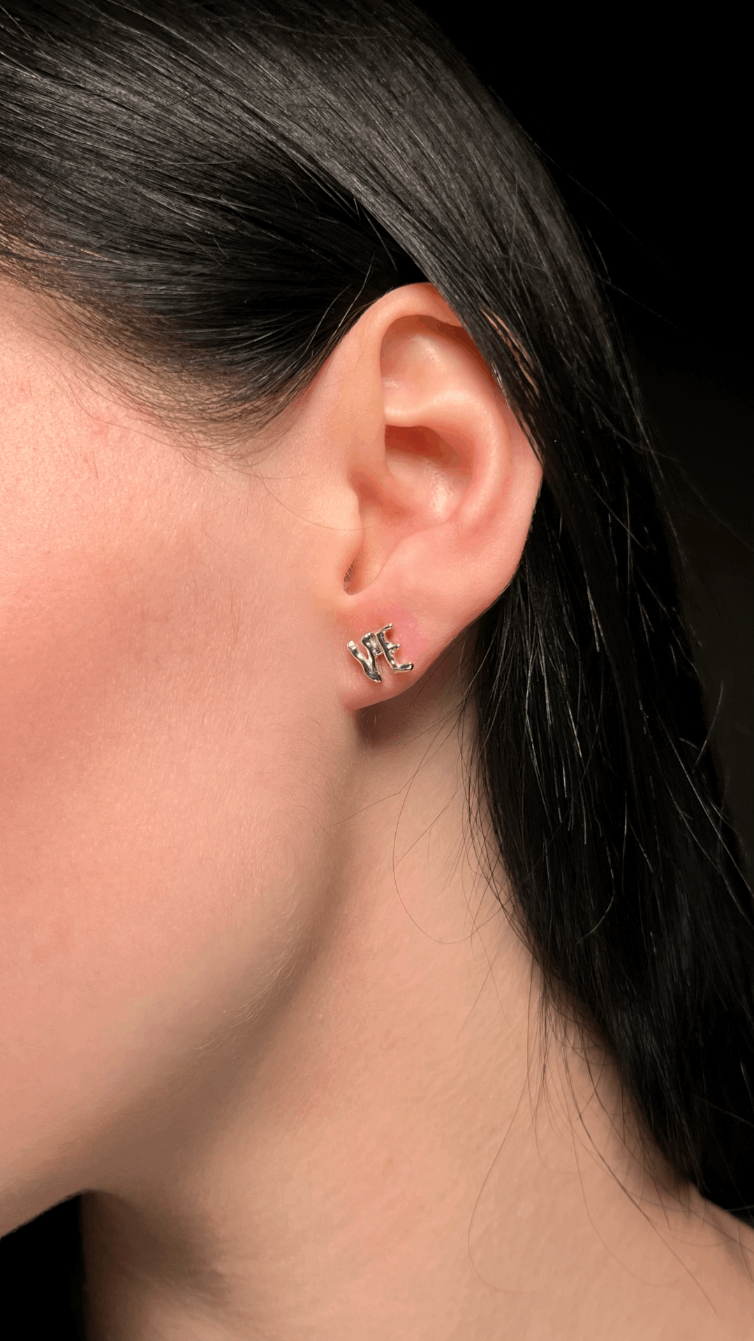 Letter earring crafted from sterling silver for a personalized touch.