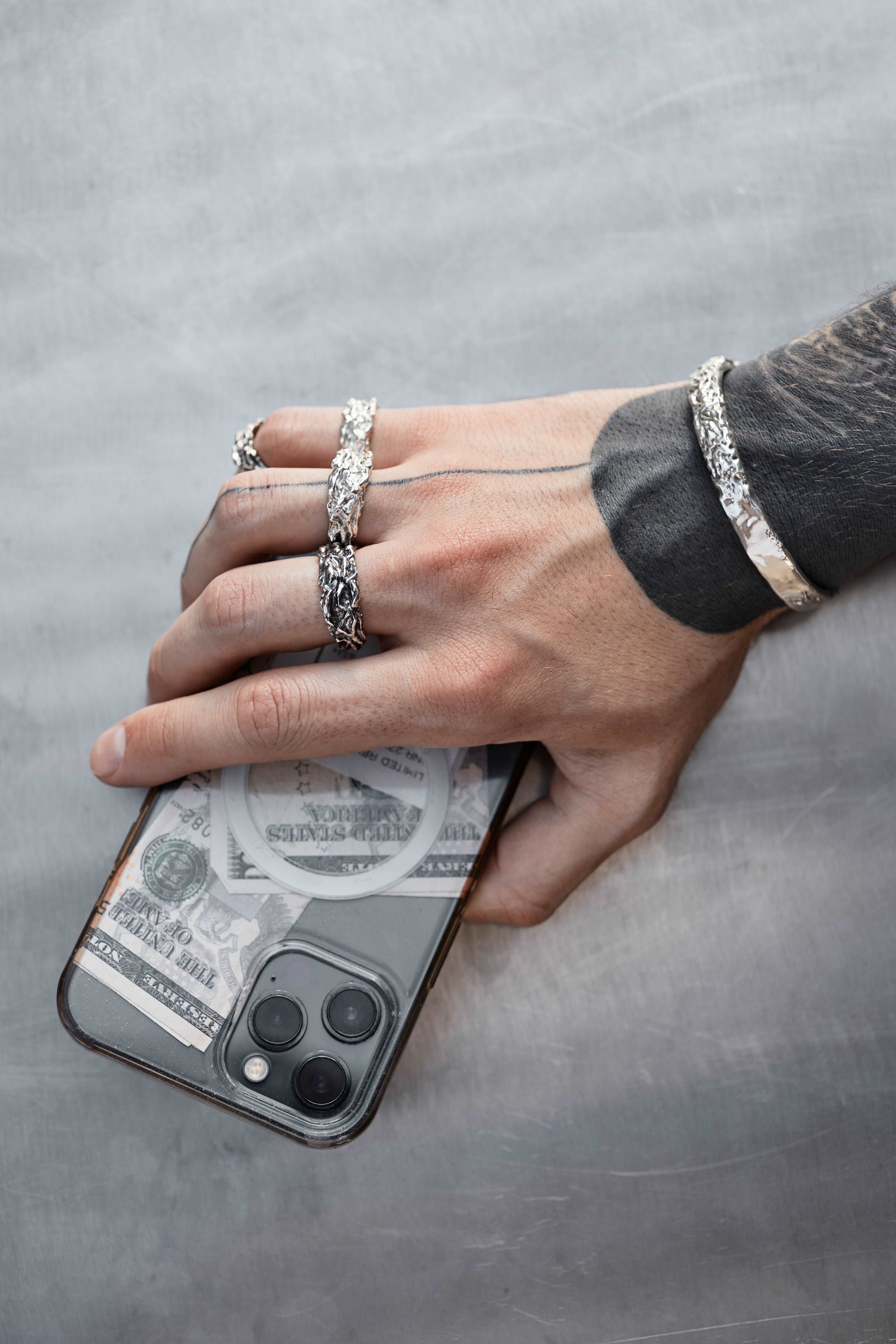 Black patina sterling silver ring with a rugged and artistic appeal.