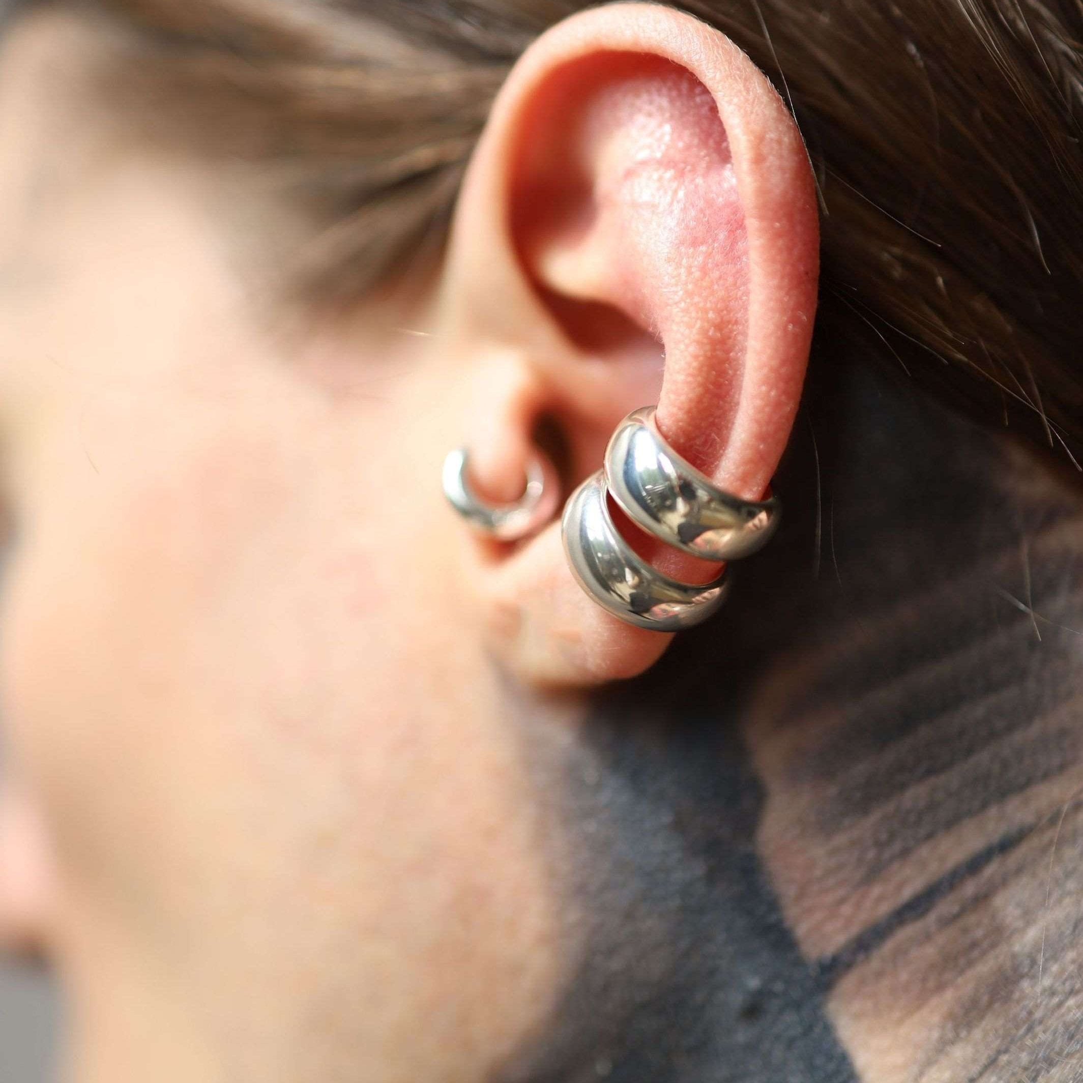 Non-piercing low domed cuff earring in polished sterling silver.