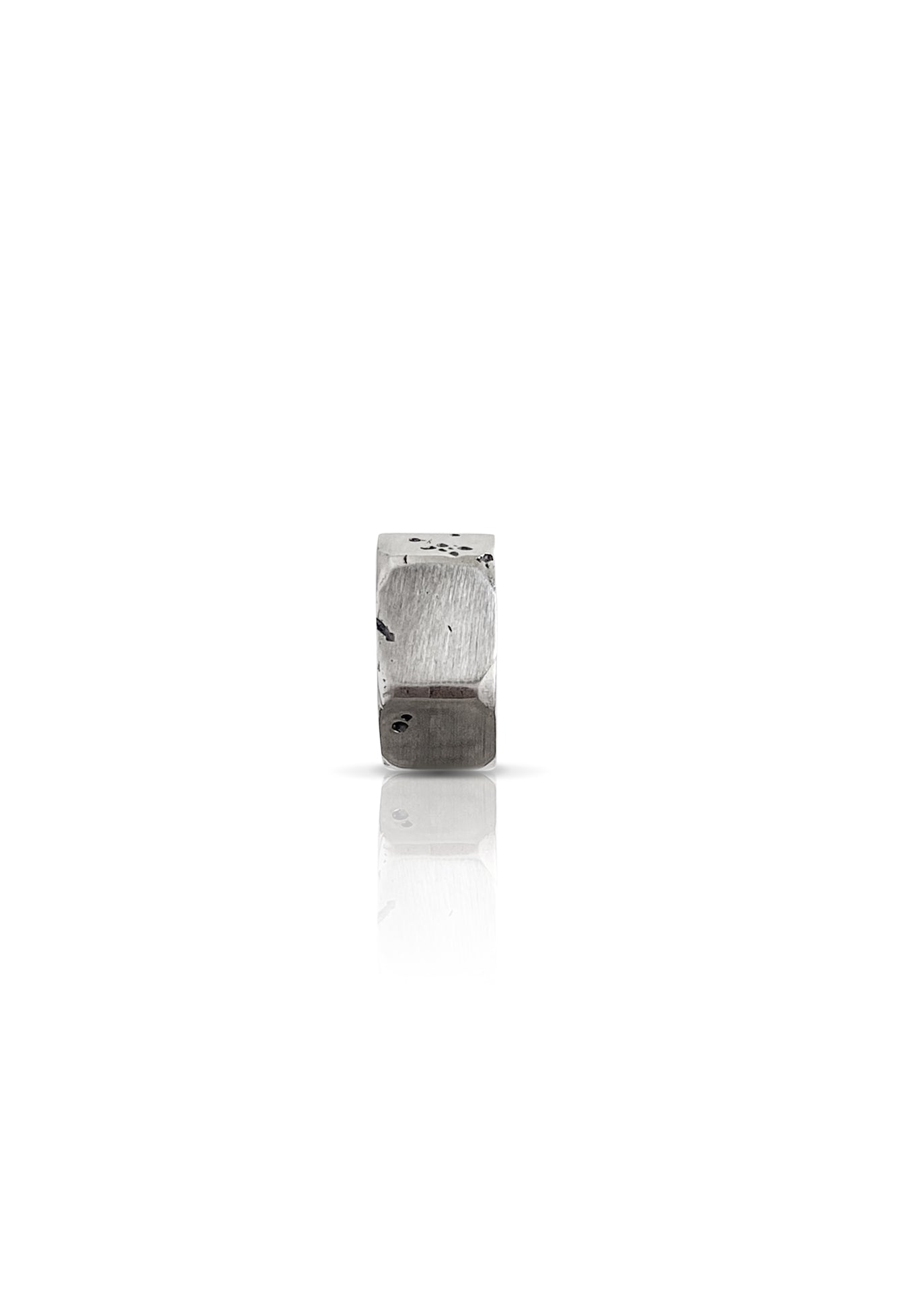 Handcrafted sterling silver huggie earring with industrial-inspired screw nut design