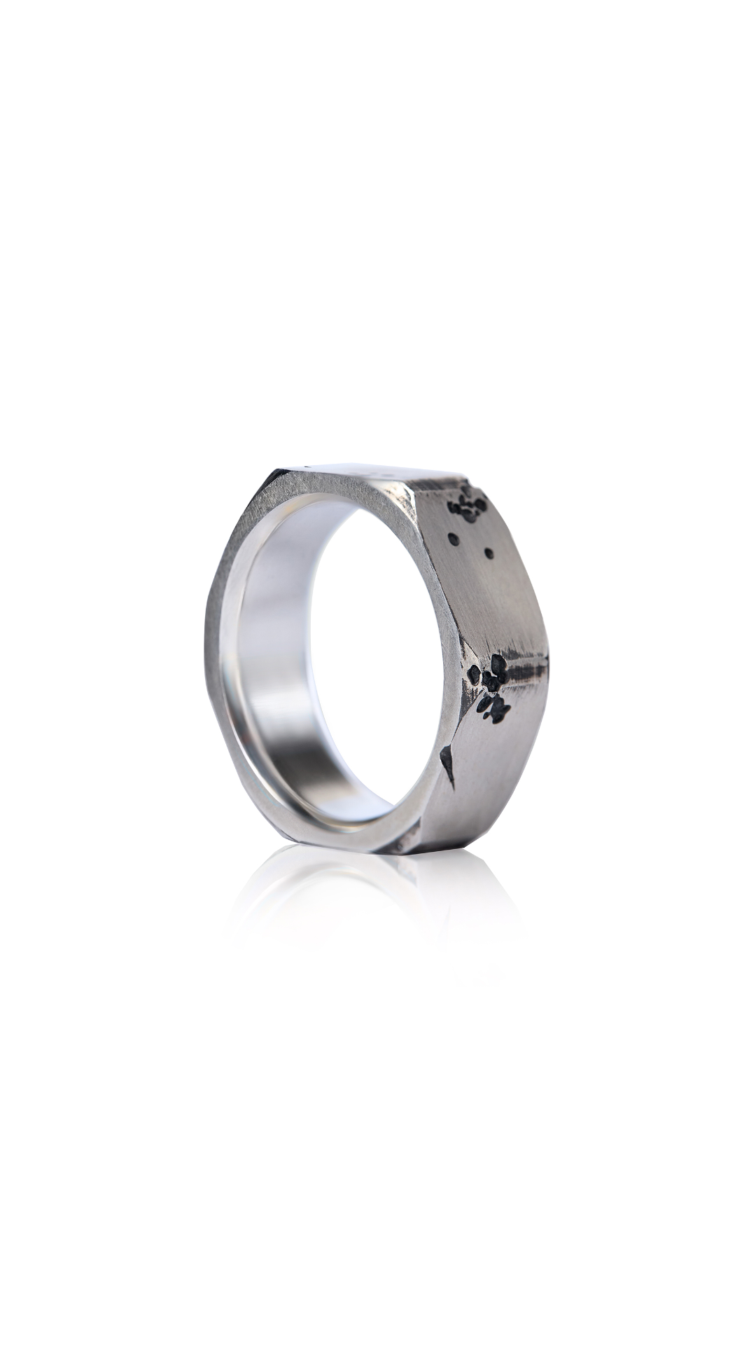 Industrial-style ring inspired by rugged designs and brutalist aesthetics.