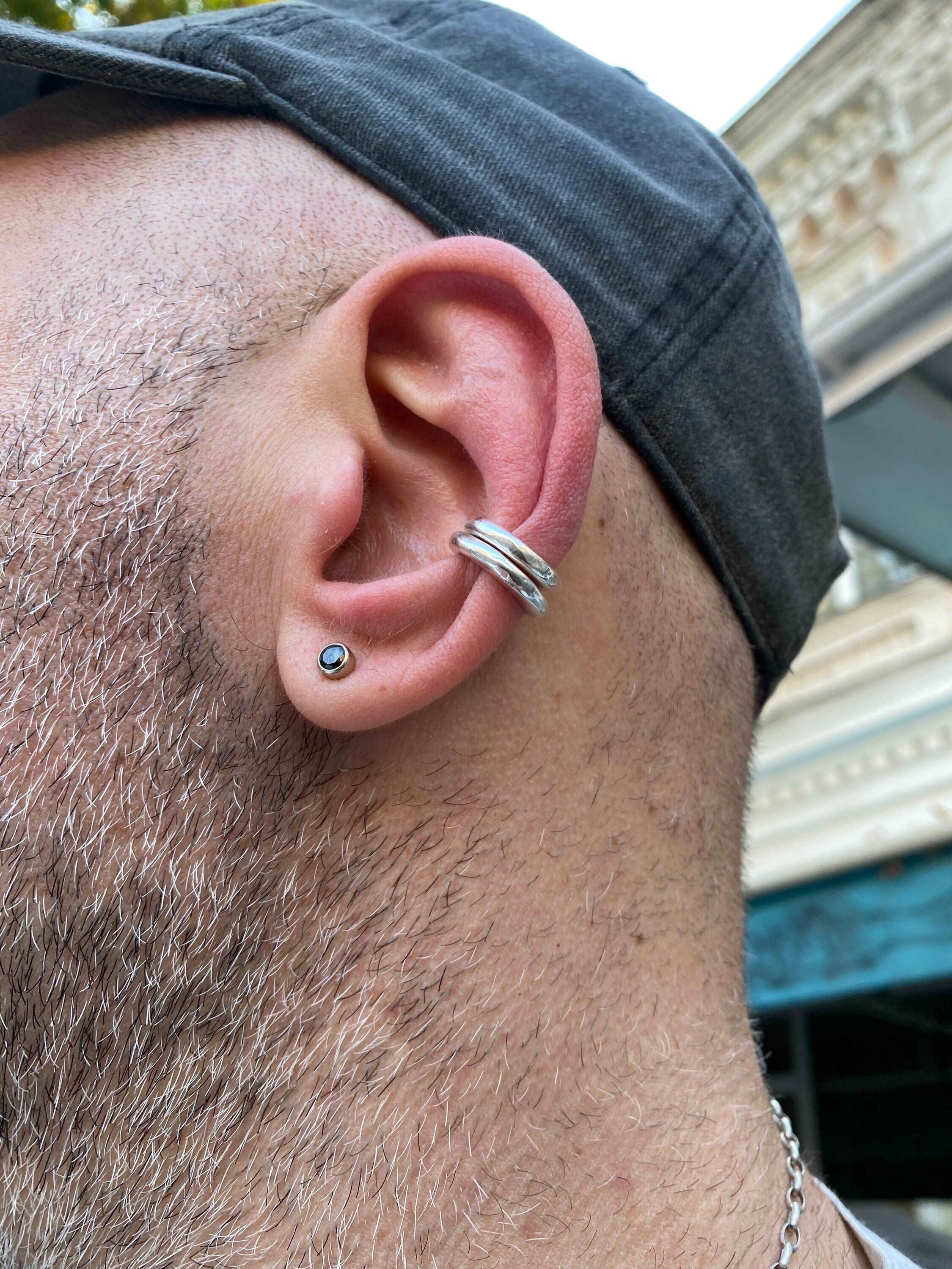 Stylish cartilage earrings and cuff set for a bold yet minimalist look.