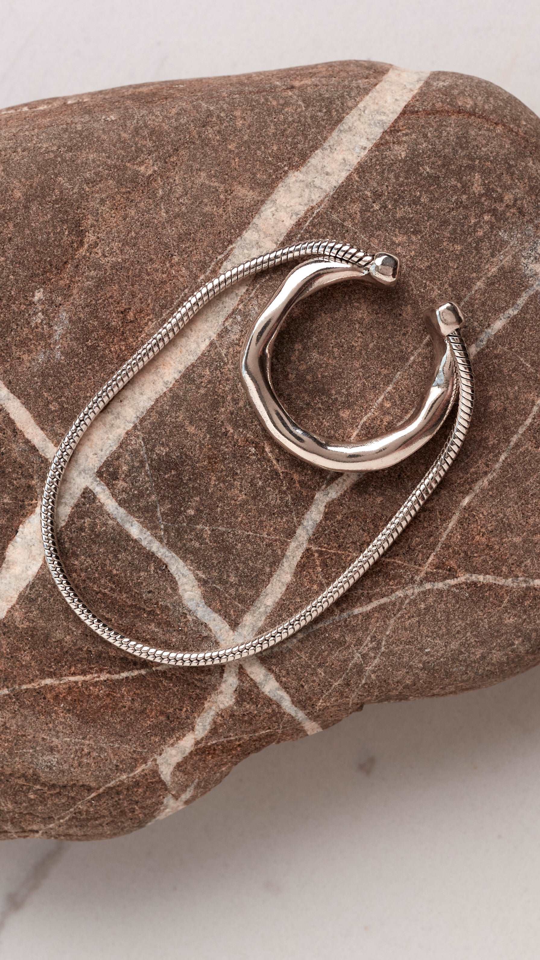 Versatile stack ear cuff showcasing minimalist silver jewelry with elegant curved silhouette