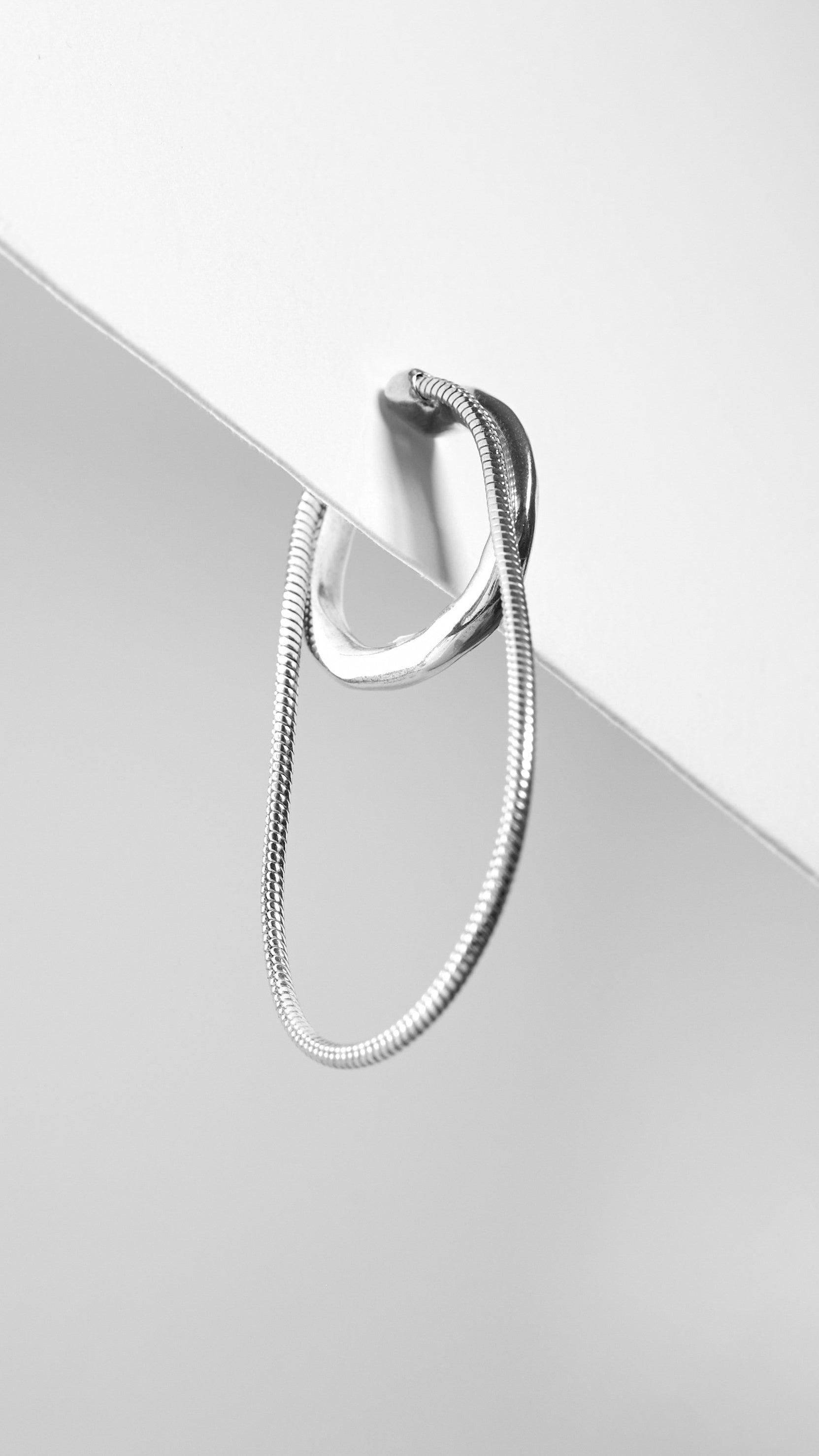 Sterling silver Snake Chain Ear Cuff for a minimalist style.