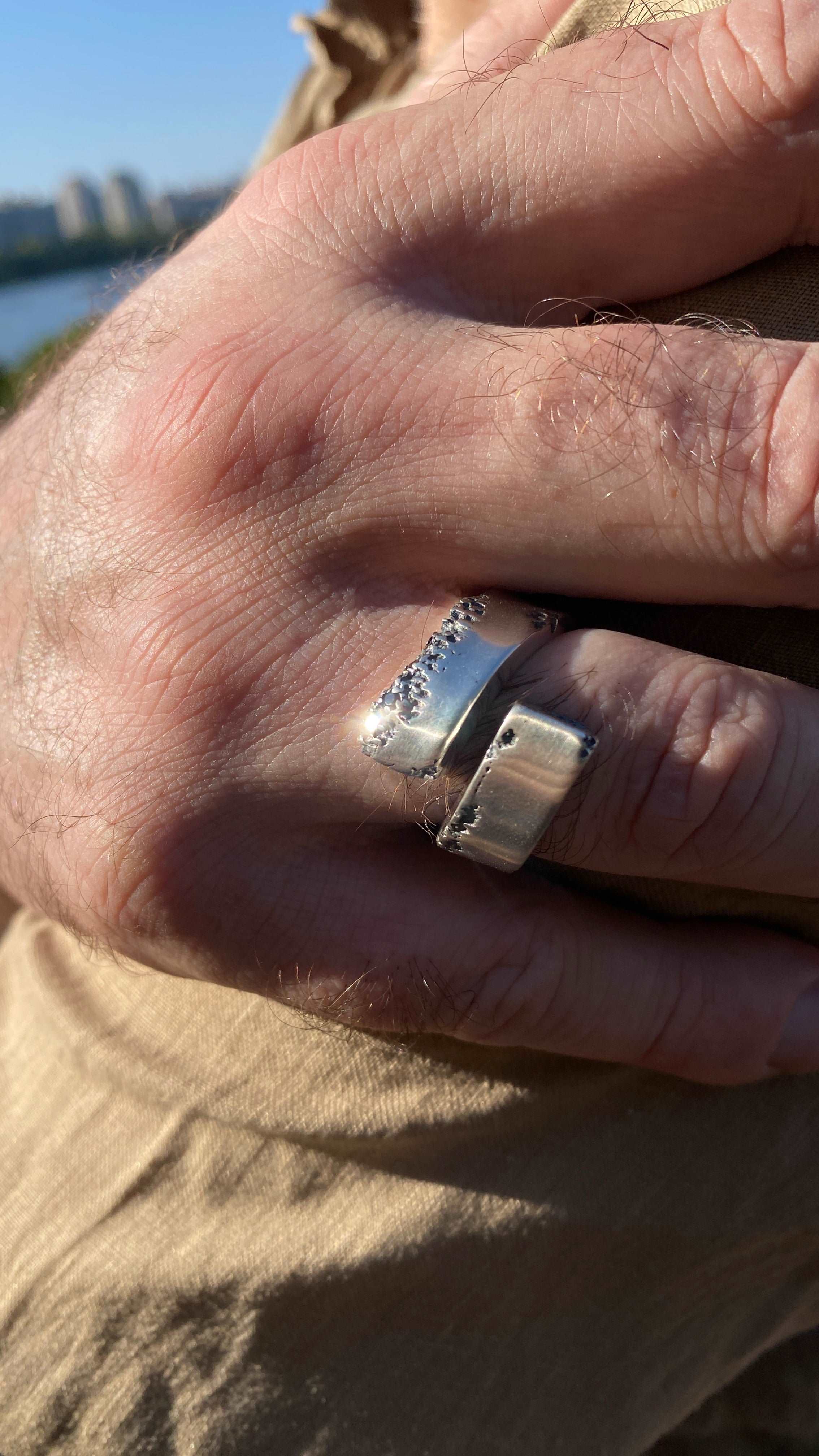 Close-up of a sterling silver ring featuring a black spinel gemstone.