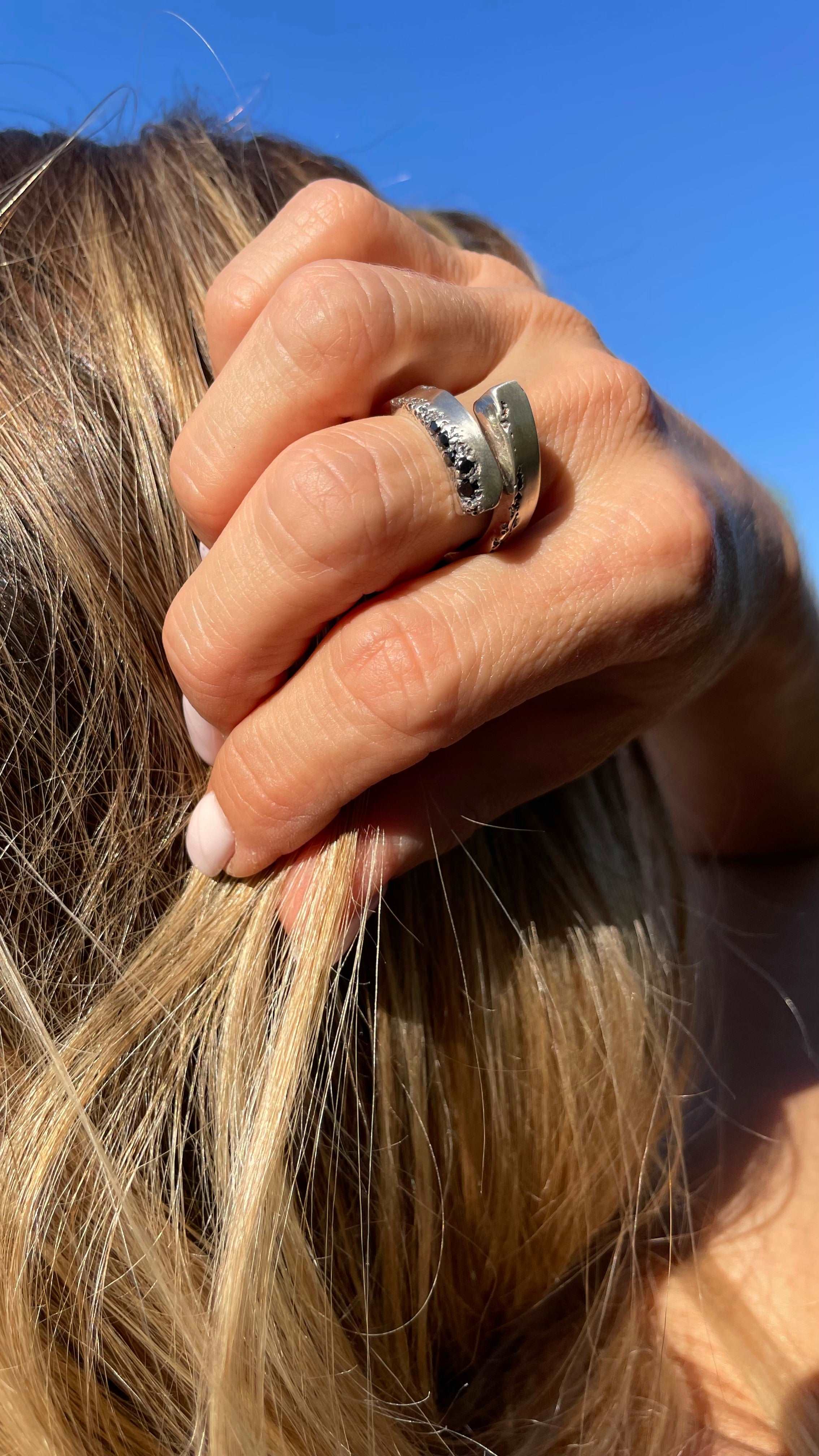 Sterling silver open ring with delicate details, ideal for everyday wear.