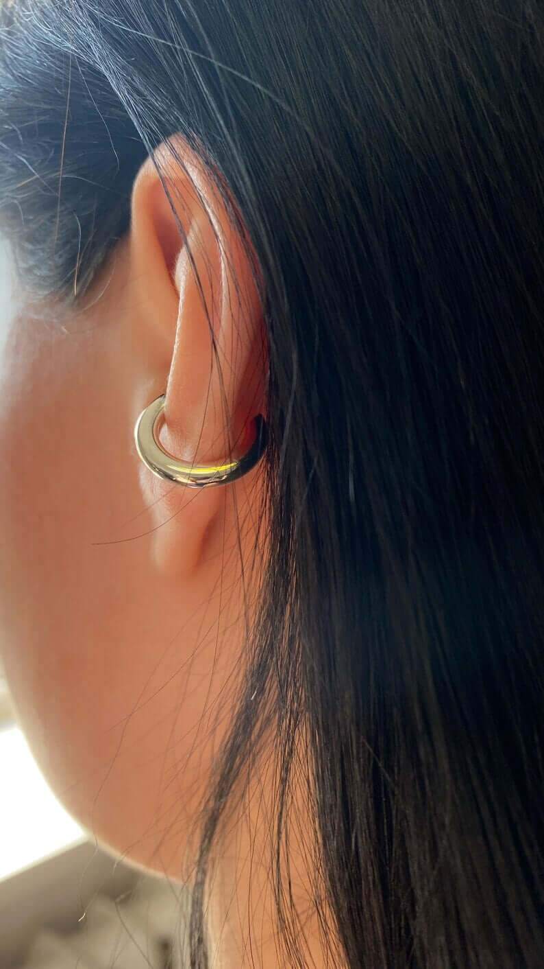 Single Cuff, minimalist cuff earring featuring a polished detail, handcrafted design, worn in ear.